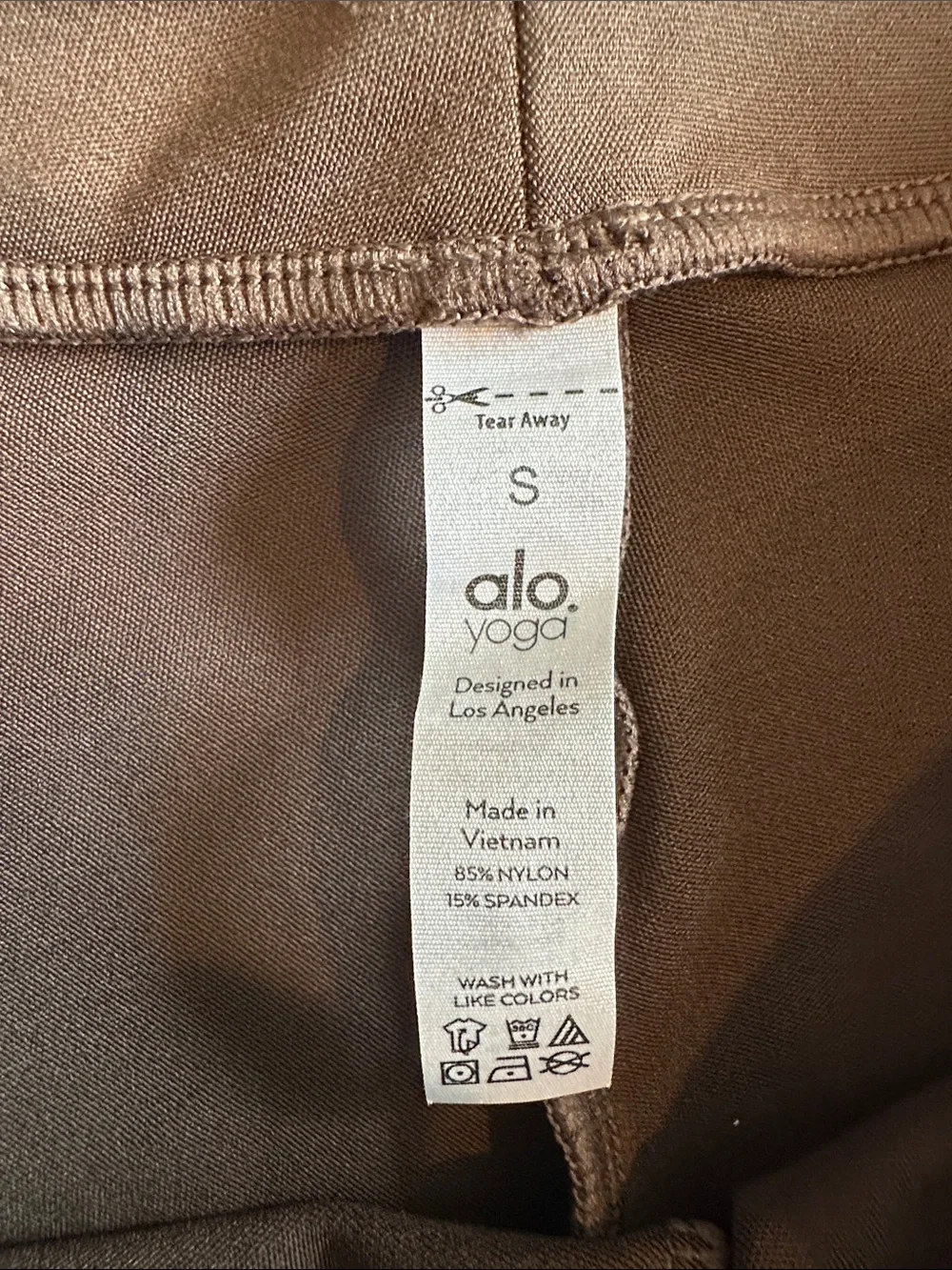 ALO Yoga Women’s Flared Leggings in Dark Olive